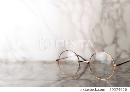 Vintage golden Eyeglasses on luxury marble stone table 29374626