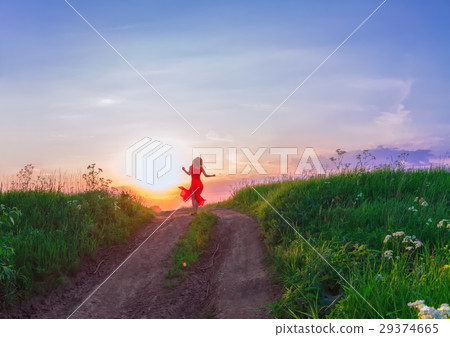 Young Woman Dancing Against The Sunset 29374665