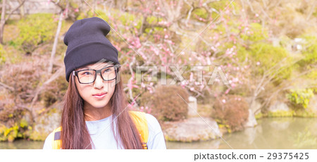 Japanese girl with glasses in a Plum blossom 29375425