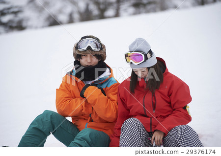 Ski area couple snowboard Ski area couple snowboard 29376174