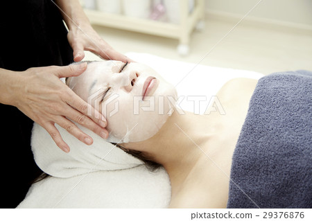 Image of beauty salon. Professional authentic esthetics, treatment and 20s female model. Moisturizing mask. 29376876