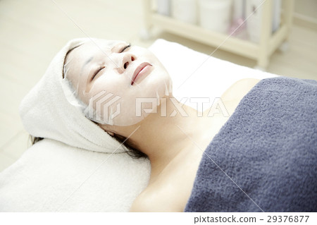 Image of beauty salon. Professional authentic esthetics, treatment and 20s female model. Moisturizing mask. 29376877