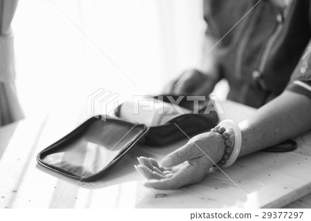 Asian senior woman checking blood pressure bl Asian senior woman checking blood pressure bl 29377297