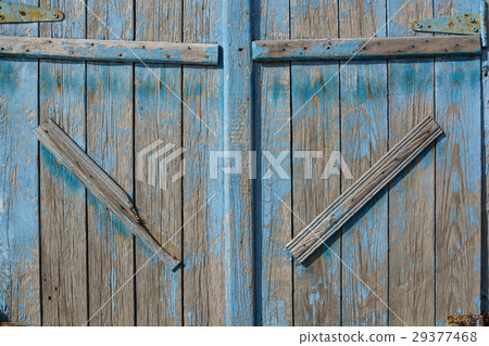 Close up of old barn door painted blue 29377468