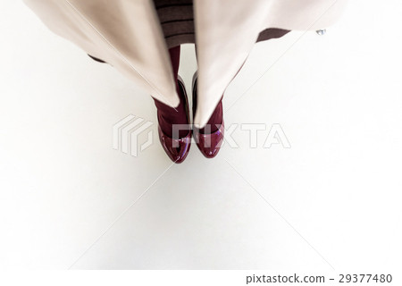 Top view of female legs and feet in dark red shoes Top view of female legs and feet in dark red shoes 29377480