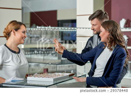 Beautiful couple at the jewelry store  29378448
