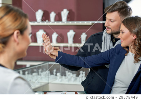 Beautiful couple at the jewelry store  29378449