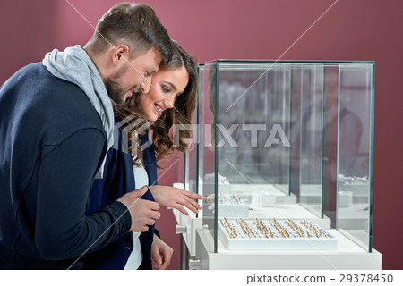 Young couple in love buying rings at the jewelry 29378450