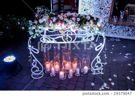 White candles in tall glass vases burn White candles in tall glass vases burn 29379047