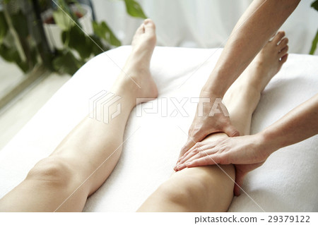 Image of beauty salon. Foot massage and treatment bed. No face. 29379122