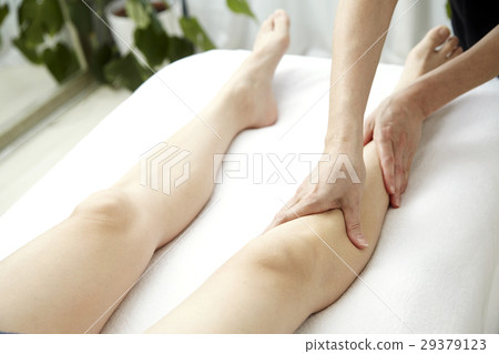 Image of beauty salon. Foot massage and treatment bed. No face. 29379123