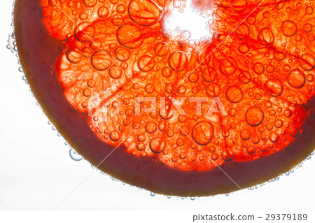 Air bubbles cover slice of grapefruit floating Air bubbles cover slice of grapefruit floating 29379189