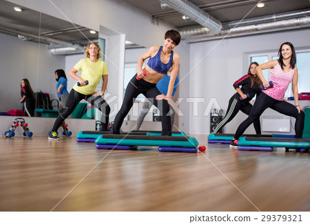 fitness group of smiling women training in gym fitness group of smiling women training in gym 29379321