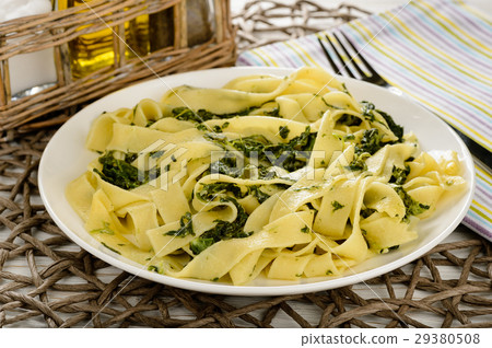 Italian pasta with spinach and sour creme. 29380508