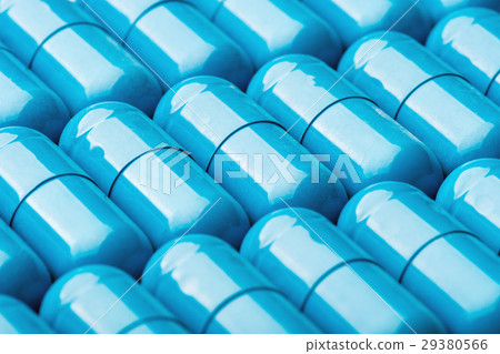 Blue softgel capsules with vitamins and minerals. Blue softgel capsules with vitamins and minerals. 29380566