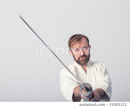 A man with katana on Iaido practice 29383312