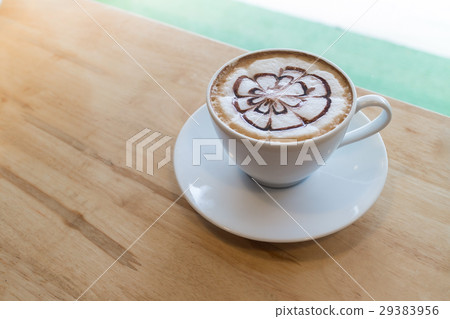 hot coffee with foam milk art in afternoon break 29383956
