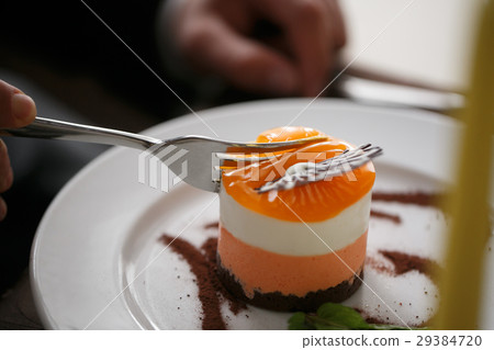 Passion fruit cake, mousse dessert on a white 29384720