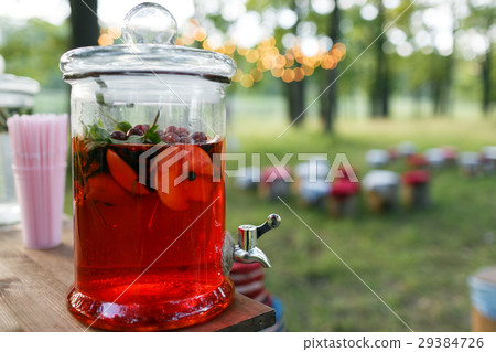 lemonade and Compote in large glass jar. Summer lemonade and Compote in large glass jar. Summer 29384726