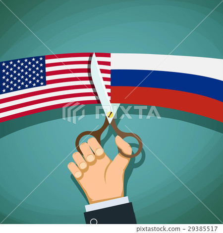 USA and Russian flags are cut with scissors. USA and Russian flags are cut with scissors. 29385517
