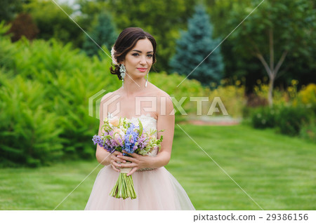 Portrait of a beautiful bride in park Portrait of a beautiful bride in park 29386156