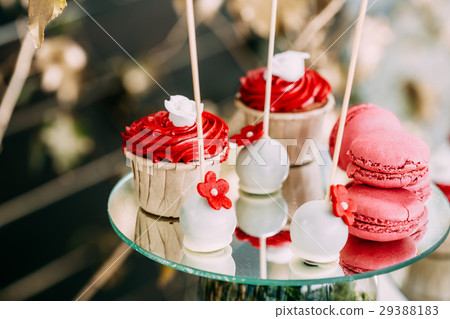 Dessert Sweet Tasty Cupcakes And Macarons In Candy 29388183