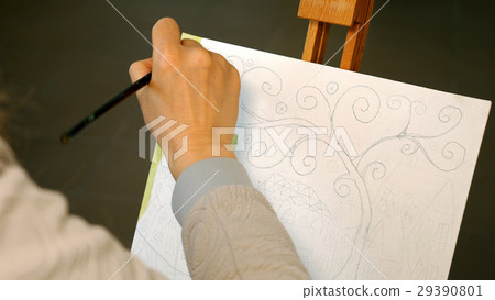 Female artist draws a pencil sketch in art studio Female artist draws a pencil sketch in art studio 29390801