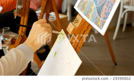 Female artist draws a pencil sketch in art studio Female artist draws a pencil sketch in art studio 29390802