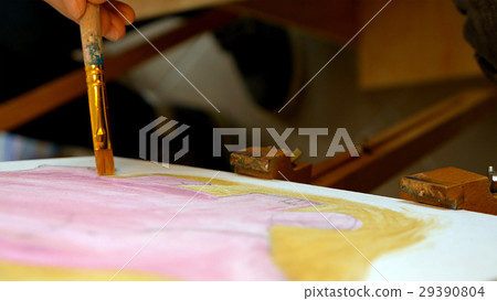 Artist paints picture artwork canvas in art studio Artist paints picture artwork canvas in art studio 29390804
