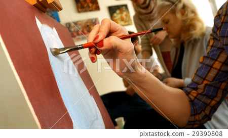 Female artist paints picture artwork in art studio Female artist paints picture artwork in art studio 29390808