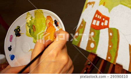 Graphic artist mixing oils color paints in palette Graphic artist mixing oils color paints in palette 29390810
