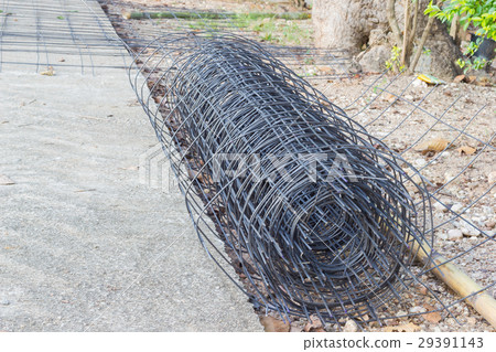 Rolls of steel wire mesh on the ground Rolls of steel wire mesh on the ground 29391143
