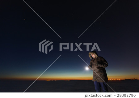 Silhouette of a man with a flashlight, observing Silhouette of a man with a flashlight, observing 29392790