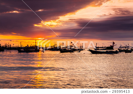 Sunset on the beach of Jimbaran. Bali 29395413