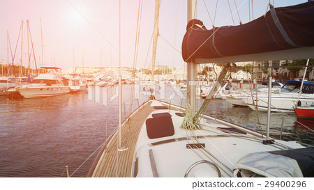 Yacht sailing toward from small yacht harbor 29400296