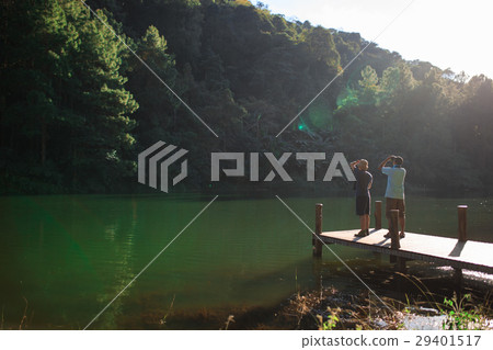 Two mans watching bird with they binocular. 29401517