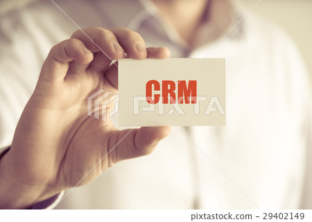 Businessman holding CRM message card 29402149