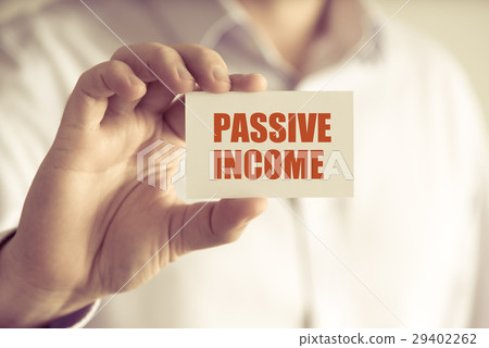 Businessman holding PASSIVE INCOME message card Businessman holding PASSIVE INCOME message card 29402262
