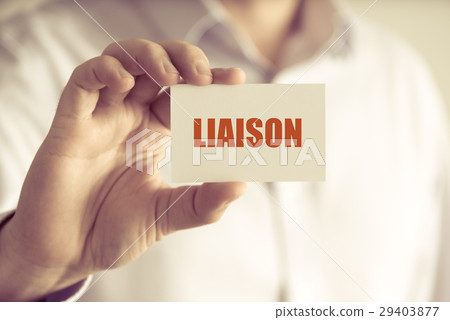 Businessman holding LIAISON message card 29403877
