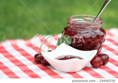 Jar of sweet cherry jam 29406556