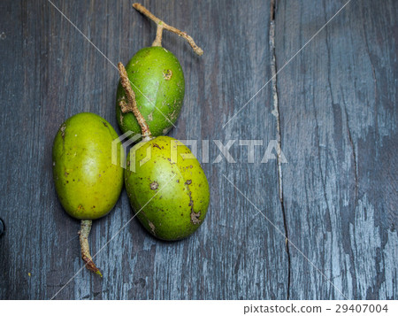 Spondias mombin on black wooden background 29407004