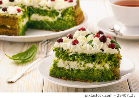 Spinach cake with cream and cranberries. Spinach cake with cream and cranberries. 29407123