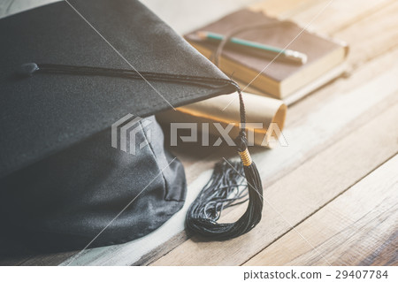 graduation cap, hat with degree paper on wood graduation cap, hat with degree paper on wood 29407784