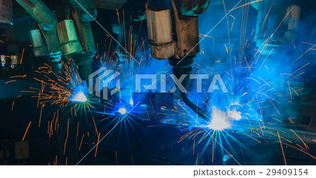 Team robots are welding in factory 29409154