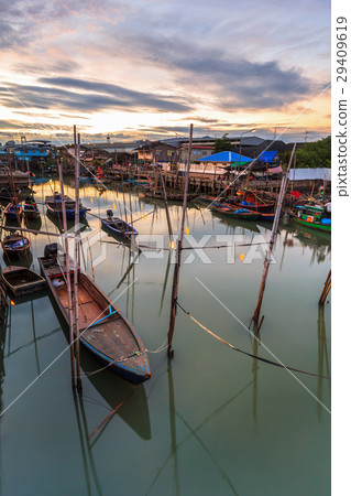 Fishing boats in harbor with sunrise Fishing boats in harbor with sunrise 29409619
