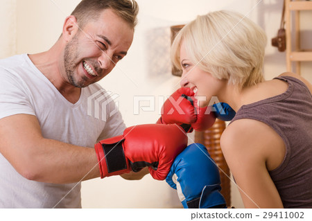 Couple man and woman having battle at home Couple man and woman having battle at home 29411002