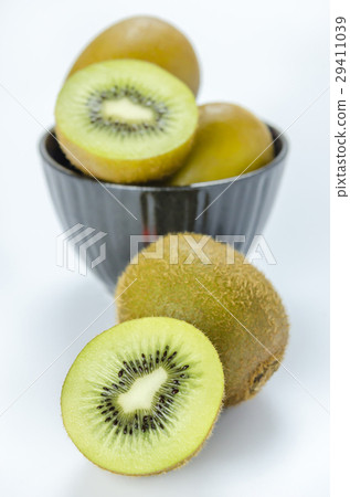 kiwi fruit and half with black bowl kiwi fruit and half with black bowl 29411039