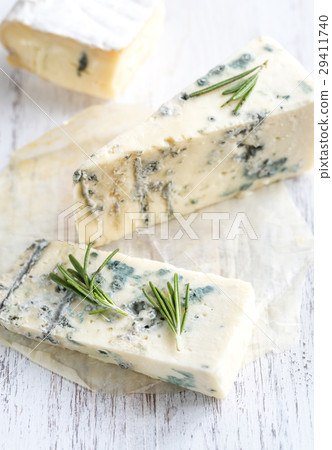 Various types of cheese on the wooden board Various types of cheese on the wooden board 29411740