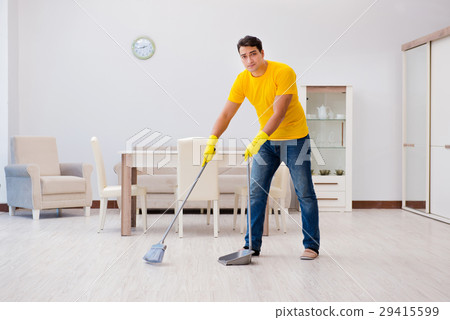 Man cleaning the house helping his wife 29415599