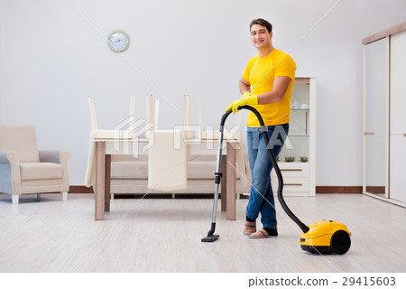 Man husband cleaning the house helping his wife Man husband cleaning the house helping his wife 29415603